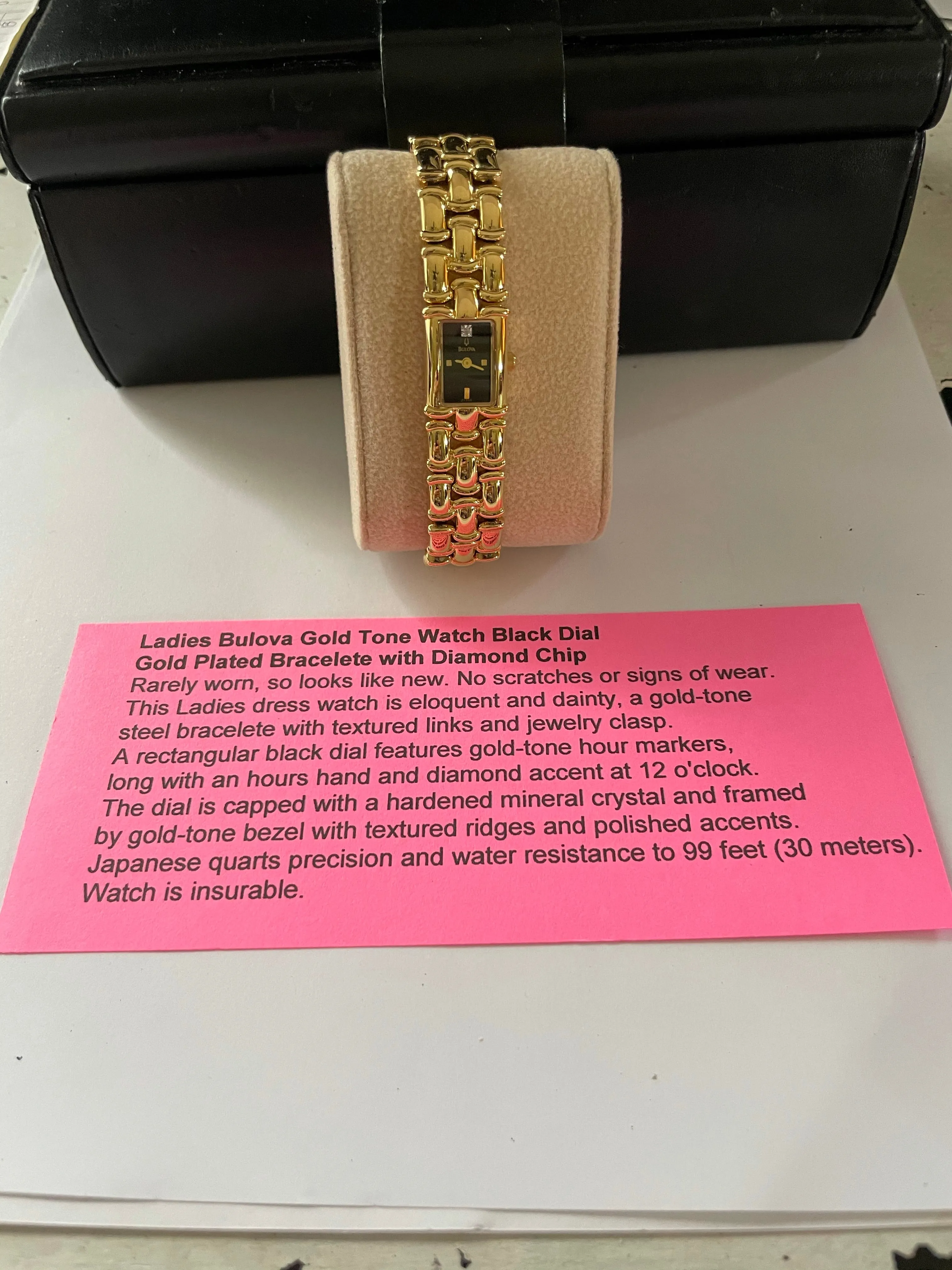 <€€ Ladies BULOVA Gold Tone Watch with Black Dial on Gold Plated Bracelete with Diamond Chip Model 97S86