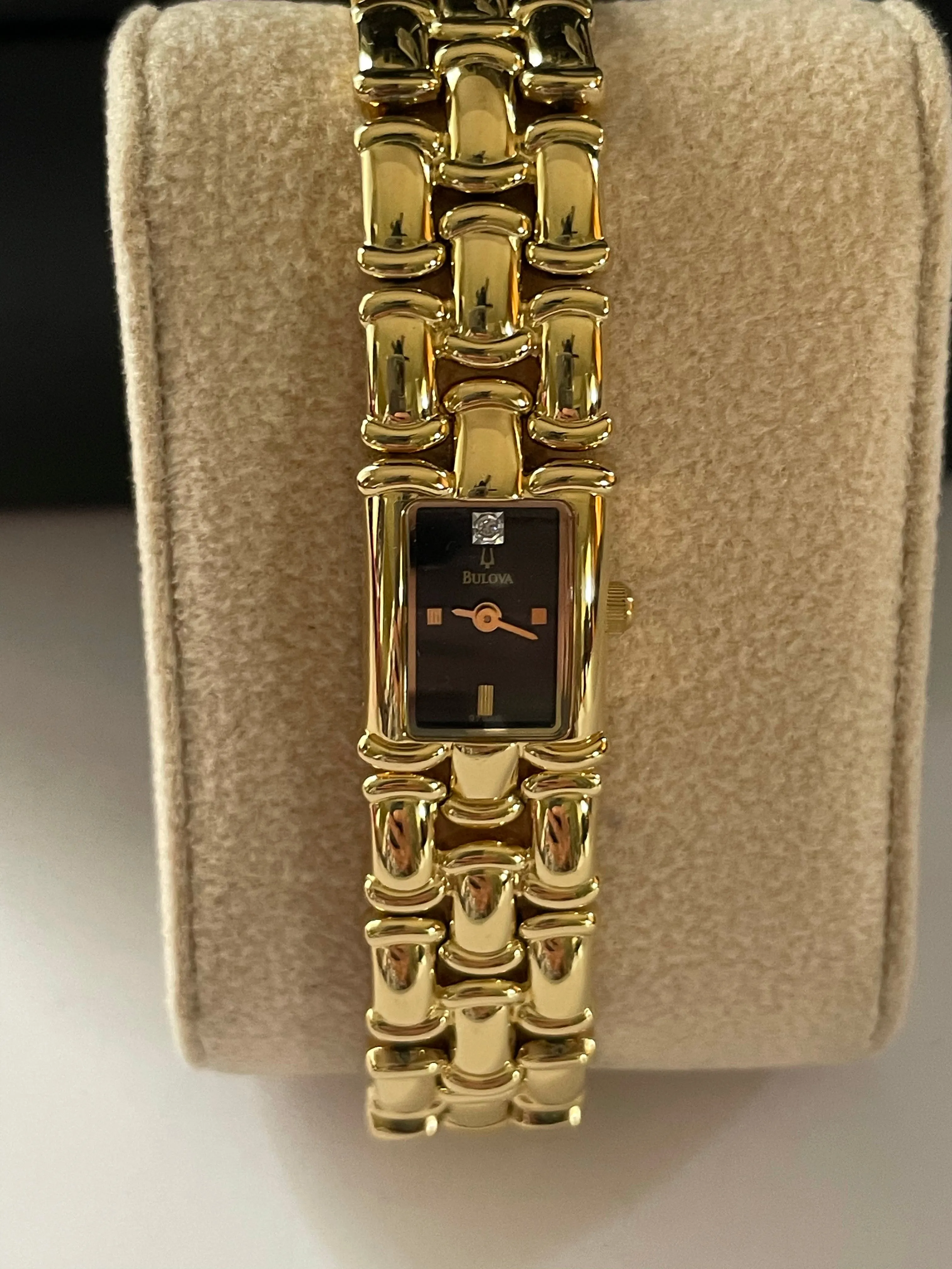 <€€ Ladies BULOVA Gold Tone Watch with Black Dial on Gold Plated Bracelete with Diamond Chip Model 97S86